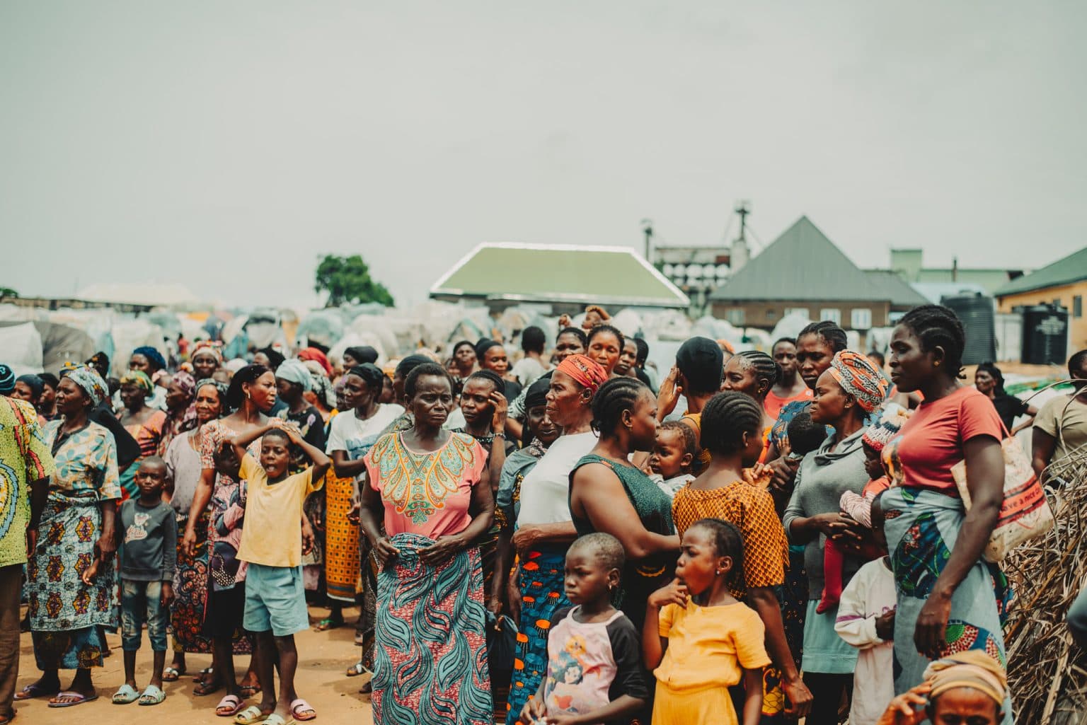 A crowd of women and children gathered in a Nigerian village